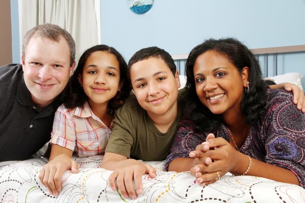 Parents Smiling With Their Children