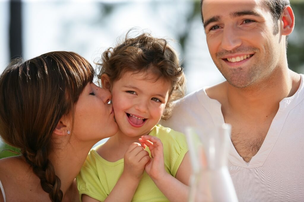 Parents Enjoying With Their Child