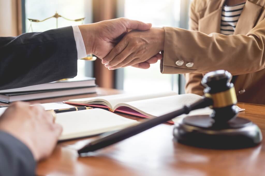 Lawyer Shaking Hands With His Client